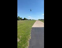 Helicopter fly over filmer land on neighborhood