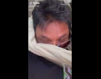 Girl pretends to rip sweater guy appears