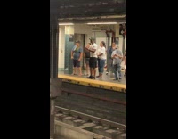 People vibe to performers music in subway station