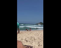 Woman bikini lay front on sand beach