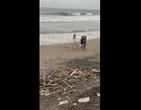 Woman poses and does photoshoot at the beach 