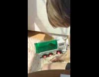 Boy play with truck with mouse inside