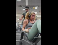 Man Helps Lady as she Struggle on Bench Presses