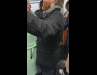 Woman scratches her nose with boyfriends beard