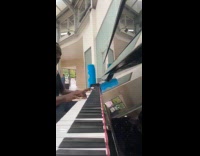 Man plays piano at the train station 