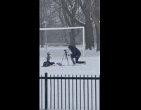 Man Records Puppet Performance at Snowy Park