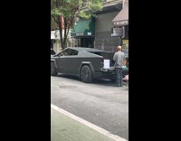 TV and PS5 on Cybertruck on street