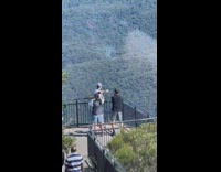 Man Leaves Mountain Range with Camera Crew