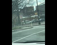 Woman riding a horse on the sidewalk