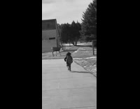 Little boy runs towards moose animal backpack