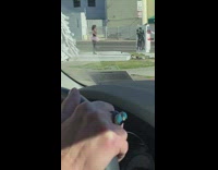 Woman pink skirt dance street FedEx truck