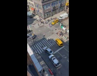 Civilians help turn a car over that was flipped during accident