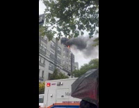 Submitter shows apartment building on fire