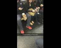Man knits a sweater on subway train