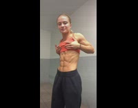 Girl shows off six pack abs muscles 