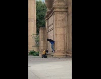 Guy climbs side of building