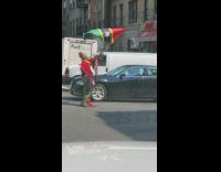 Man hold flag middle of the street