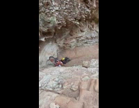 Guy rides dirt bike up rocks fail