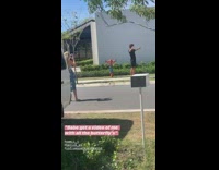 Man black shirt photo shoot sidewalk butterflies