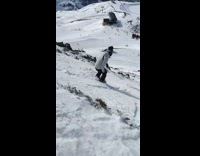 Guy slides down mountain on shoes 