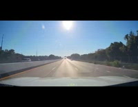 Car flies across freeway accident