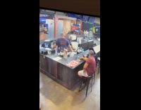 Man carries margarita bucket and spilled it