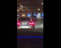 Guy sticks upper body out car window for music video 