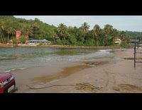 Red car beach sink sand high tide