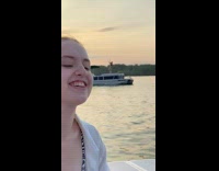 Woman pole dancing on boat 