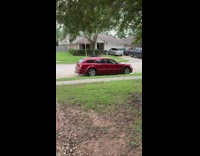 Red dodge magnum station wagon car driveway