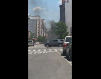 Shopping cart with burning tire on street