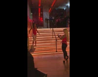 Pink leotard white leggings girl red stairs 