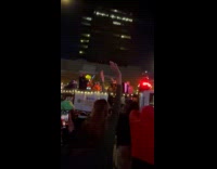 Crowd parties at street organized by NYPD