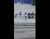 Two guys beside evolution of man mural