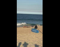 Woman black bikini upside down yoga beach