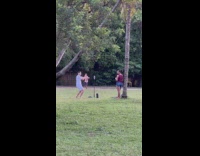 Man in white shirt tiktok dance at the park