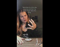 Artist drawing looks at finger bend move