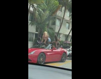 Two woman bikini twerk red convertible car