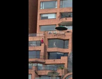 White bikini girl red shirt guy balcony 