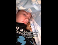 Overstimulated woman and orange cat under blanket