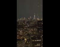 Lightning bolt strikes top of tall skyscraper 