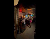 Woman pink dress dance to live band