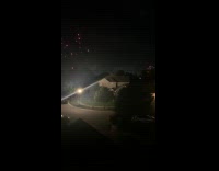 Fireworks explode at the same time night