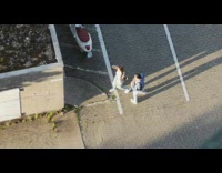 Two women dance titkok parking lot sunny