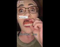 Woman pulls out her dentures 