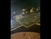 White truck missing front tire drives at night