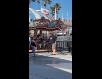 Man lowers phone for selfie at park