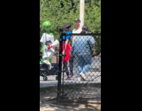 Teen pulling wagon with statue of alien