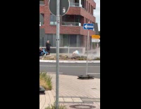 Woman in mermaid costume with three photographers