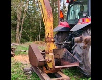 Yellow machine wood logs cut into pieces